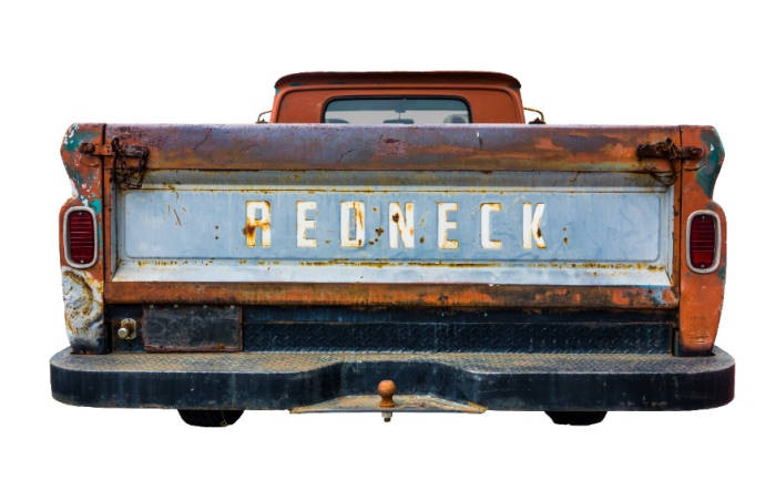 Grungy Old Pickup Truck With Redneck On The Back