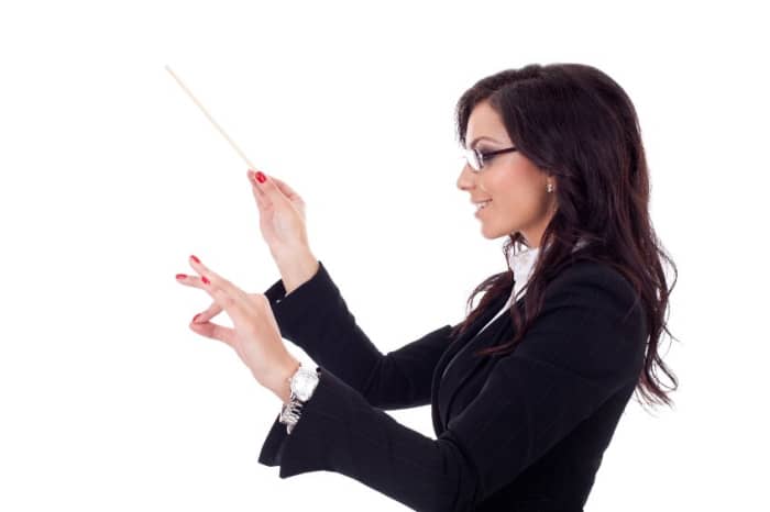 Woman conducting band