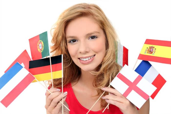 exchange student holding flags of different countries