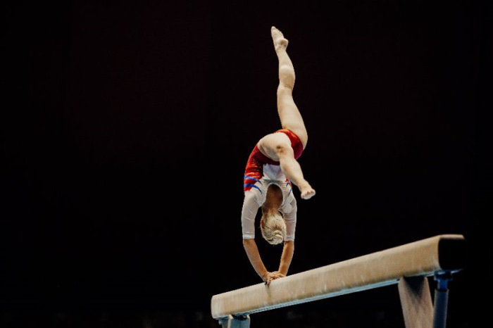 gymnast doing balance beam
