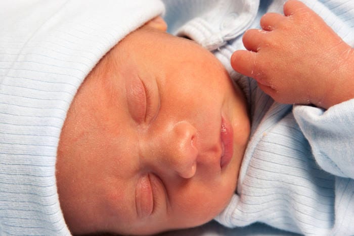 Portrait of a Sweet preemie Newborn Baby Boy Sleeping