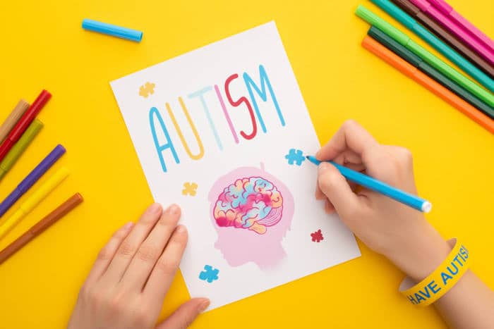 woman drawing Autism picture