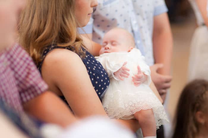 women holding baby for baby dedication