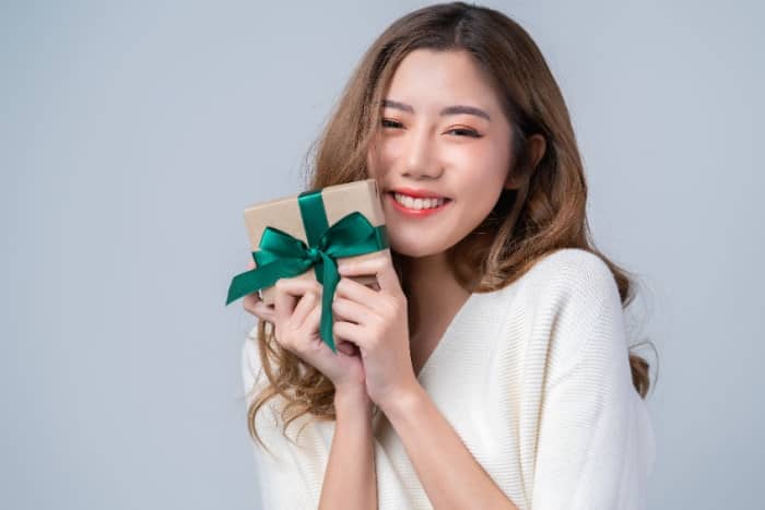 Japanese woman holding an American gift