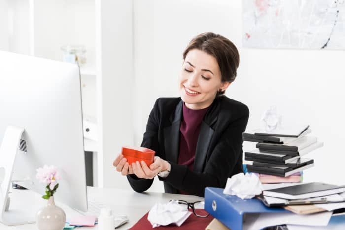 woman getting valentine's day gift at work