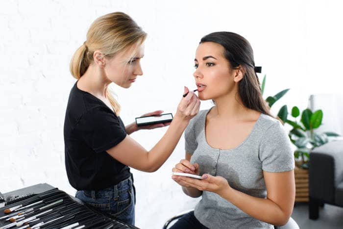 makeup artist doing a woman's makeup