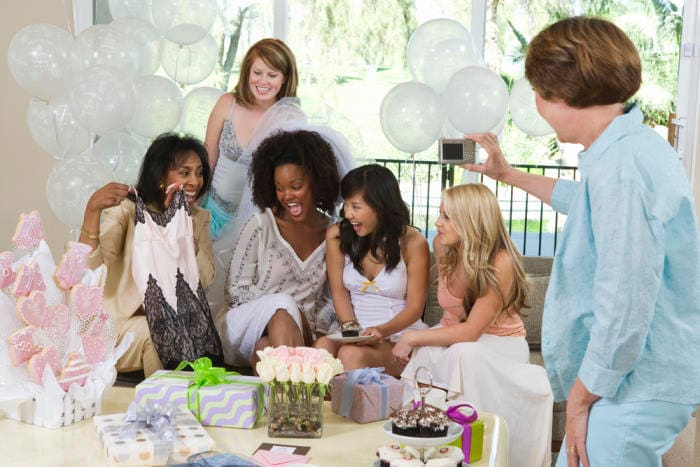 Bride celebrating with friends at bridal shower