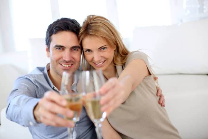 couple celebrating anniversary with champagne