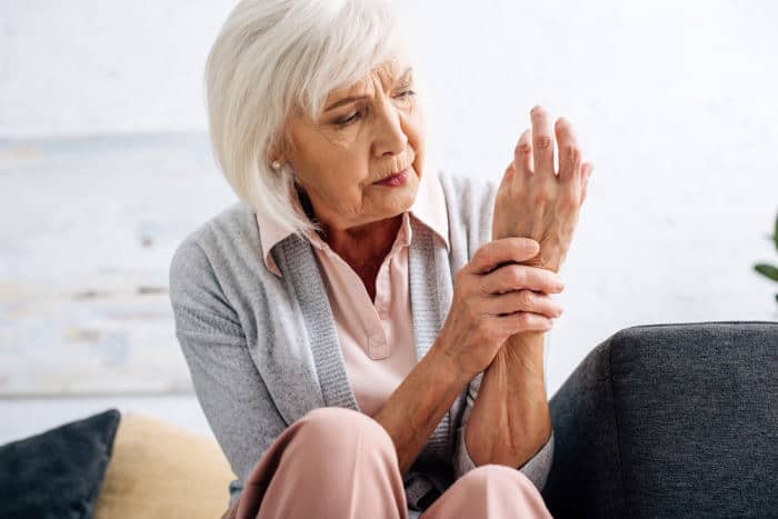 woman with arthritis in hand