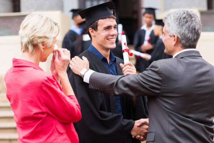 Man graduating law school and parents congratulating him
