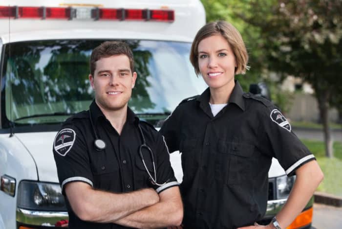 2 paramedics by their ambulance