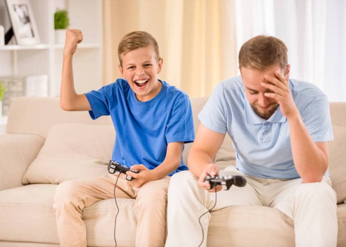 uncle and nephew playing video game