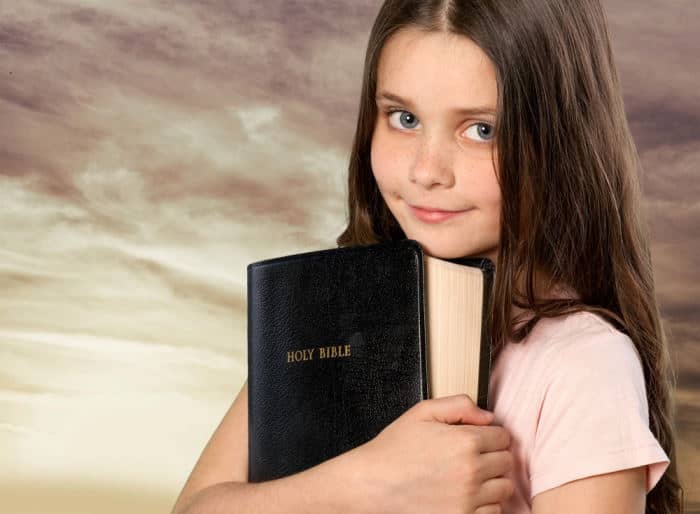 Girl holding bible
