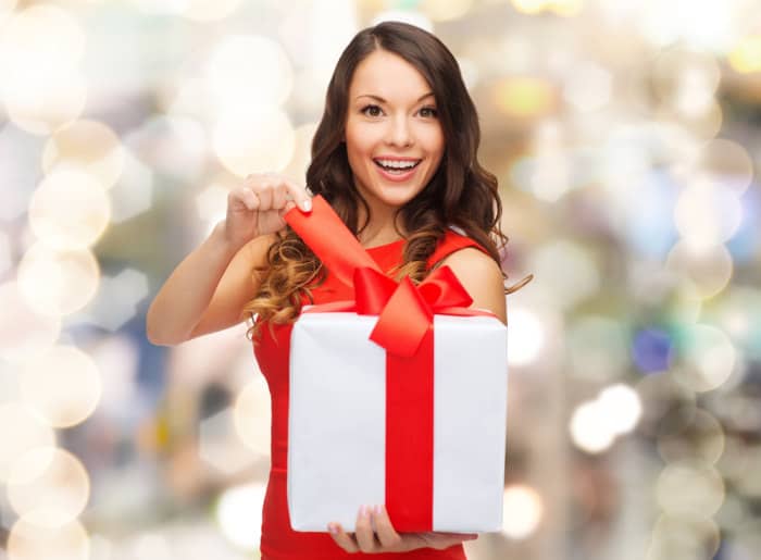 woman opening gift