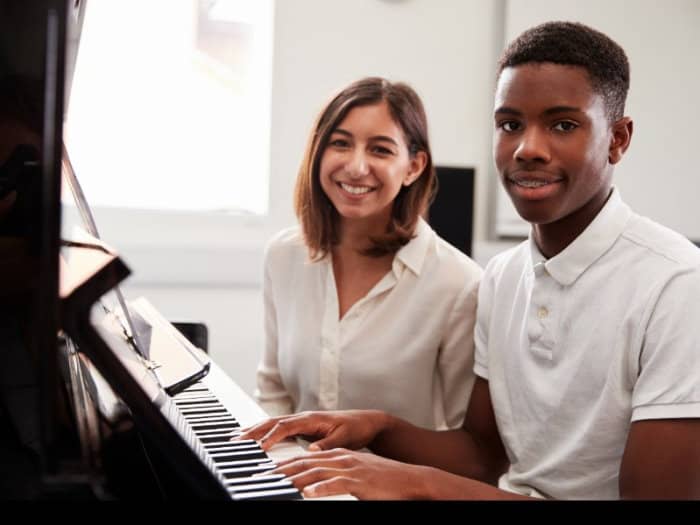 Piano teacher is teaching a student